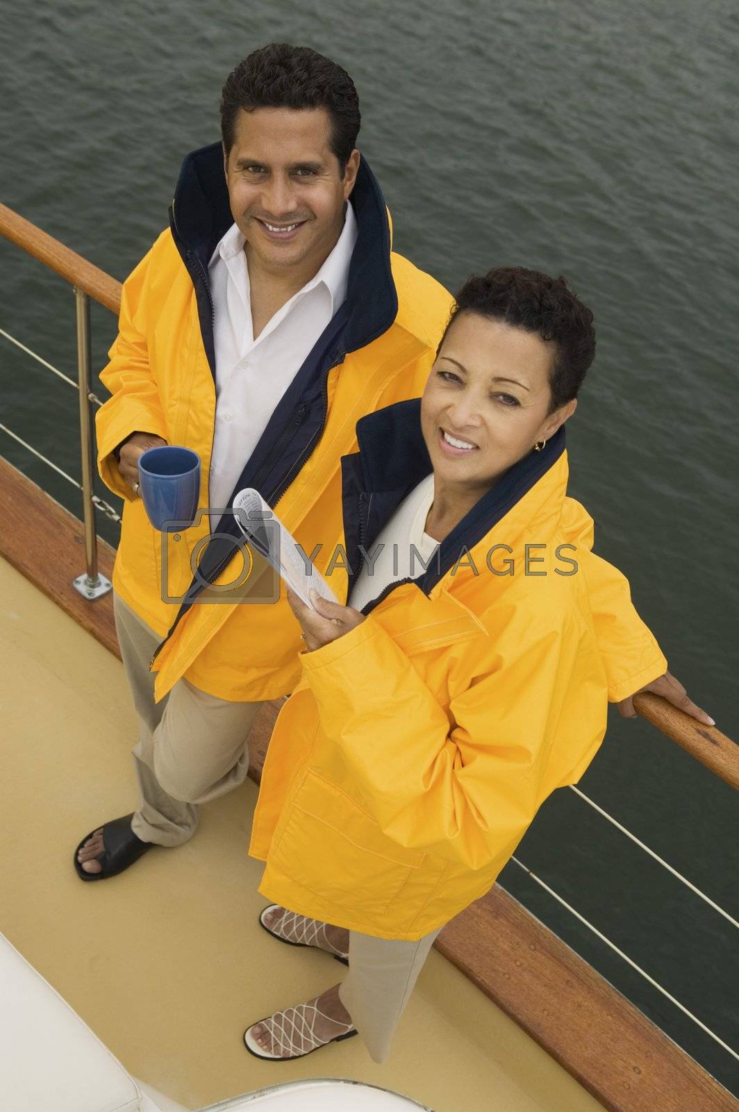 Royalty free image of Couple Leaning Against Boat Railing by moodboard