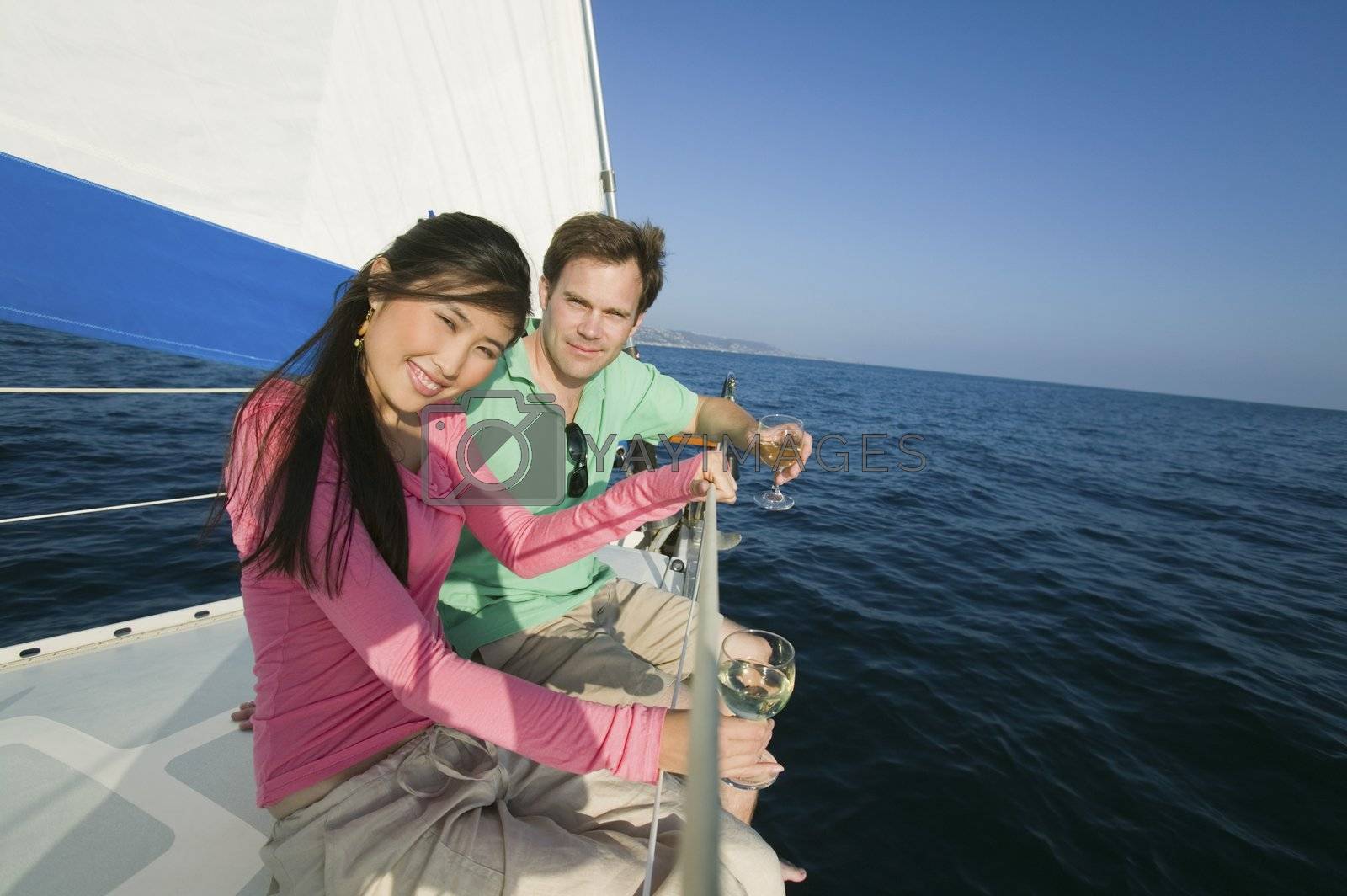Royalty free image of Couple Drinking Wine on Sailboat by moodboard