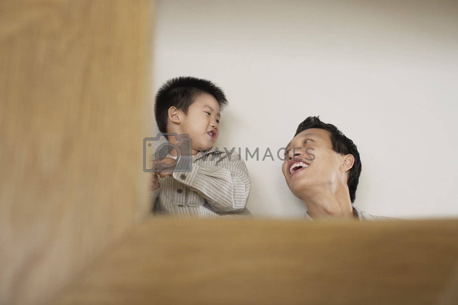 Royalty free image of Young Man with Son by moodboard