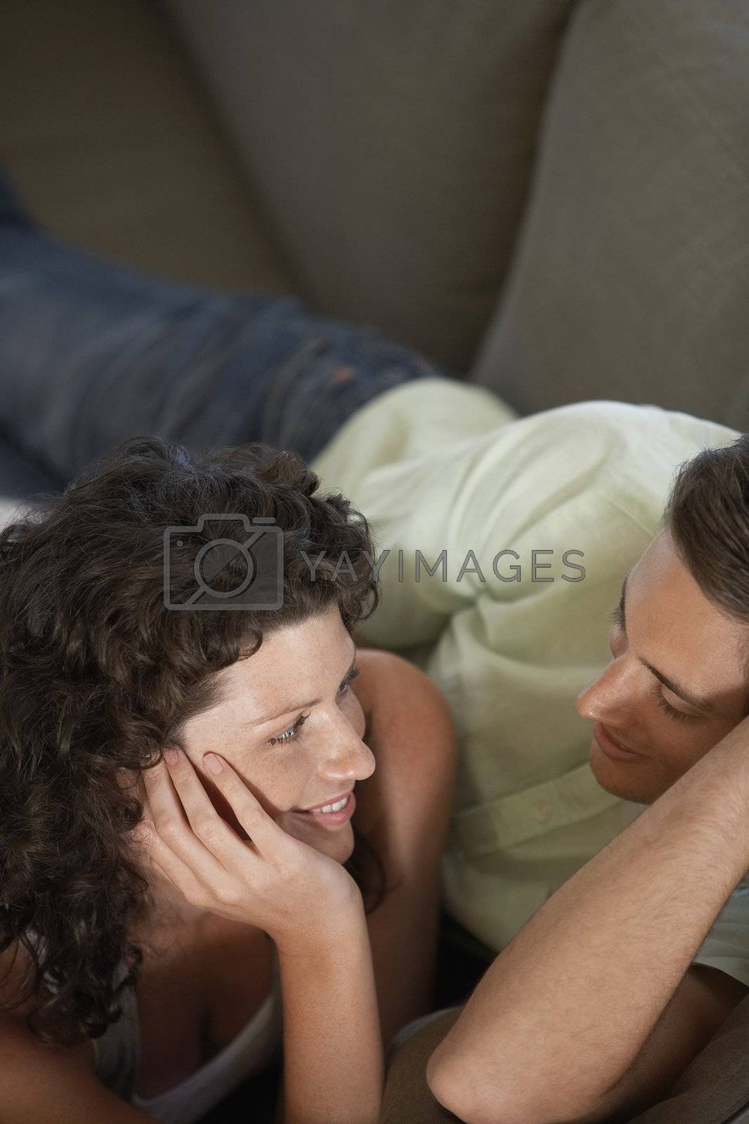 Royalty free image of Couple Relaxing on Couch by moodboard