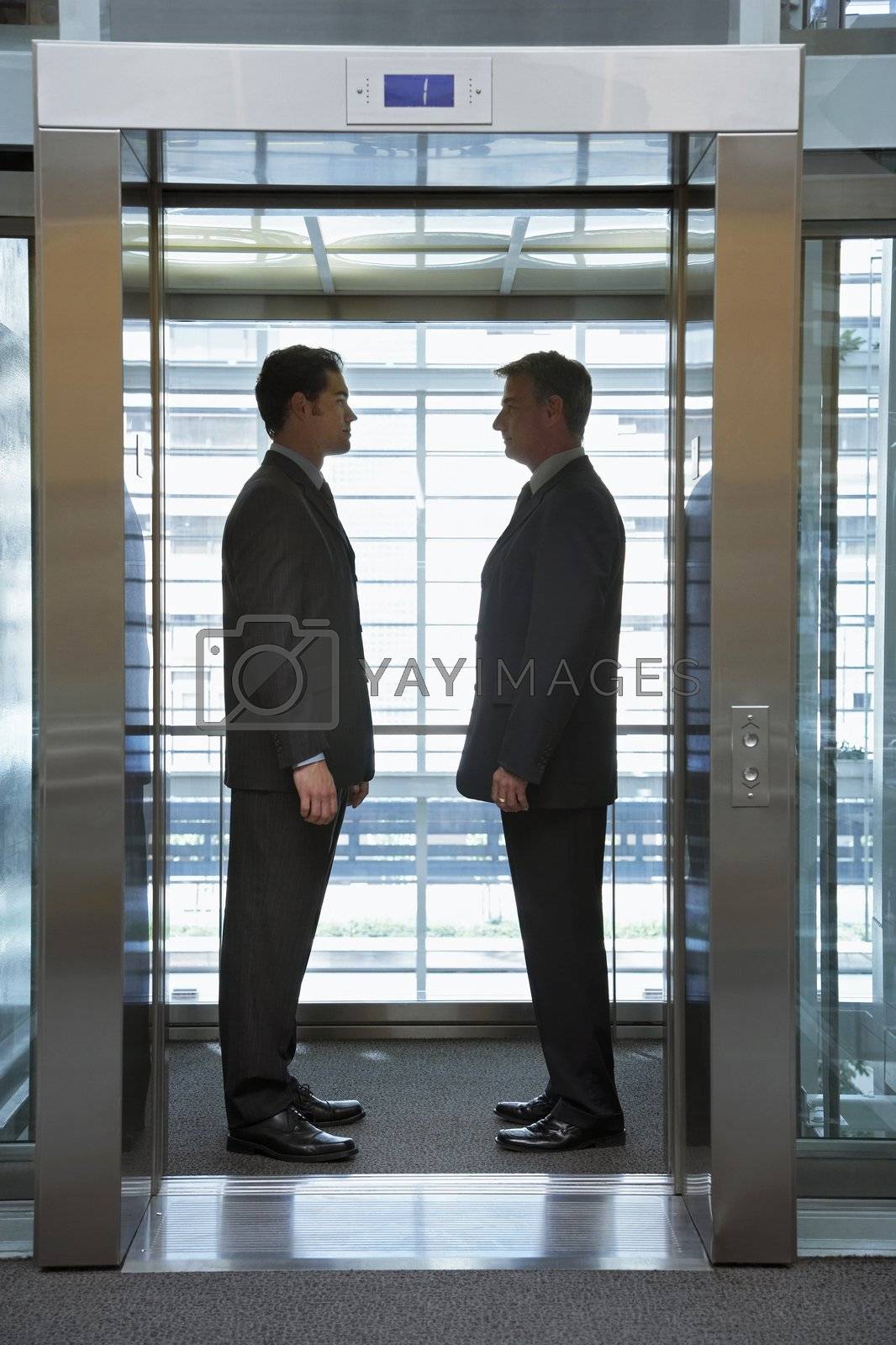 Royalty free image of Businessmen Standing Face to Face by moodboard