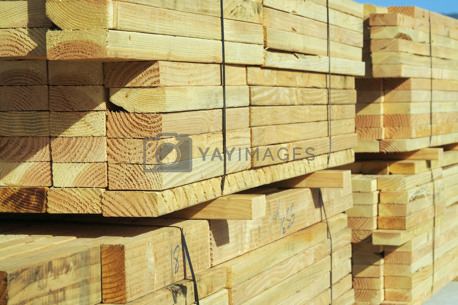 Royalty free image of Stack of Construction Wood by Feverpitched