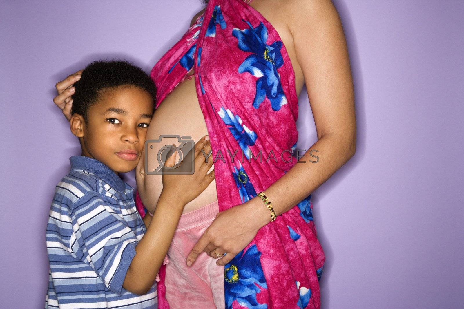 Royalty free image of Son and pregnant mother. by iofoto