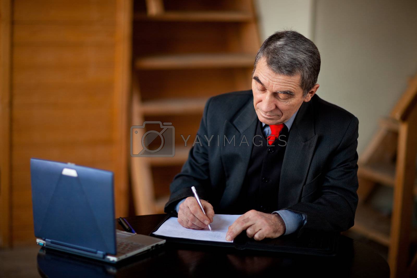 Royalty free image of Writing businessman by Gravicapa