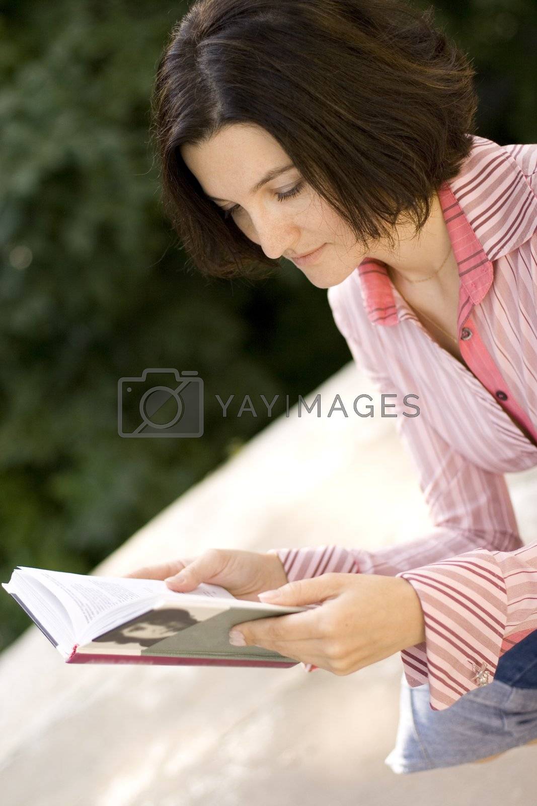 Royalty free image of woman with book by marylooo