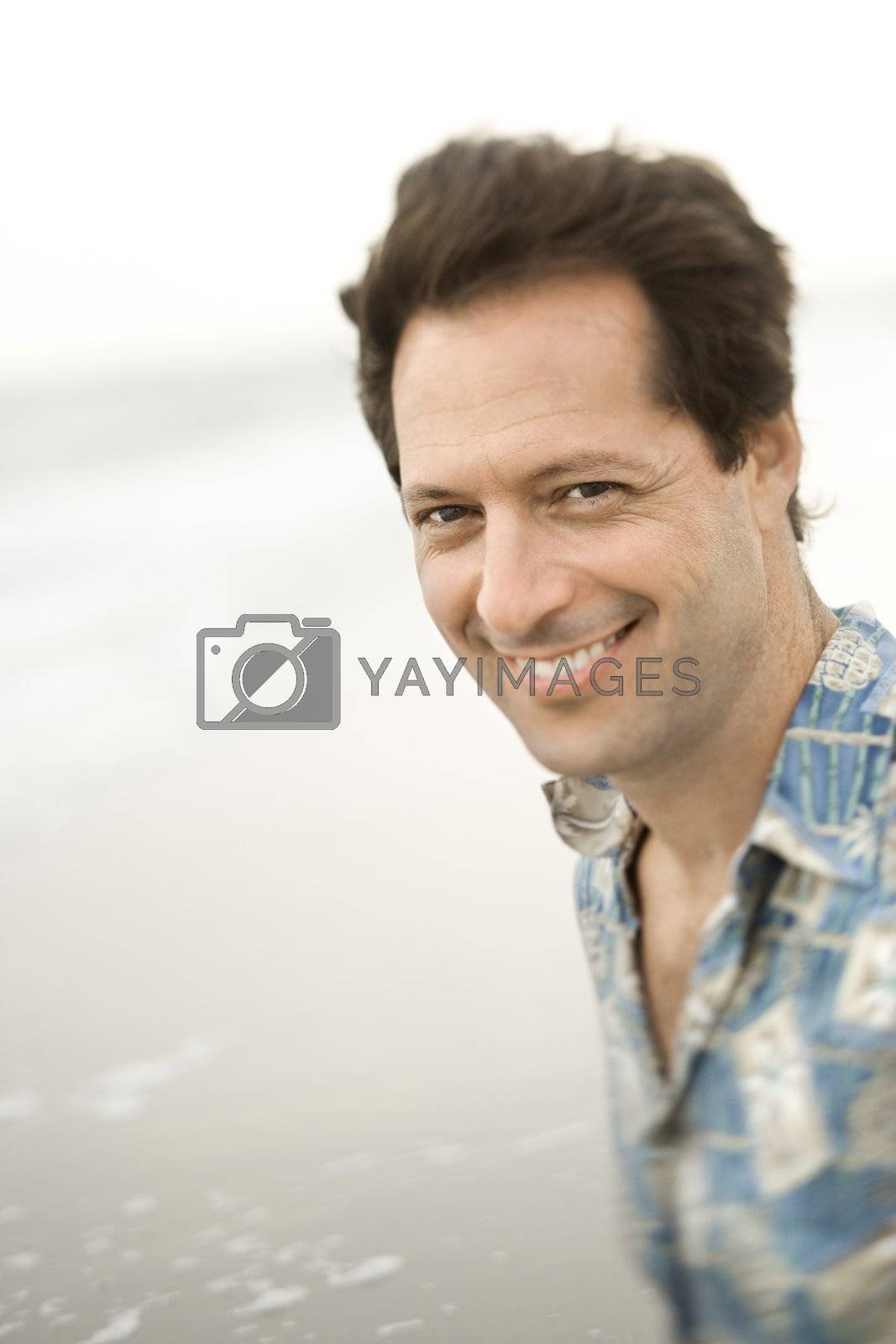 Royalty free image of Portrait of man at beach. by iofoto