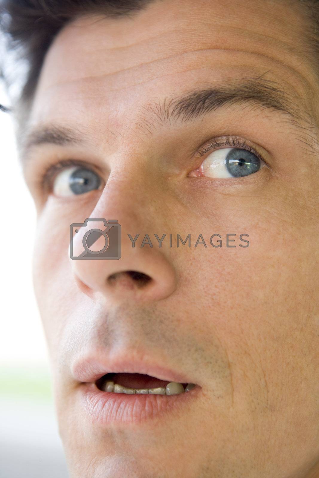 Royalty free image of Head shot of worried man by MonkeyBusiness