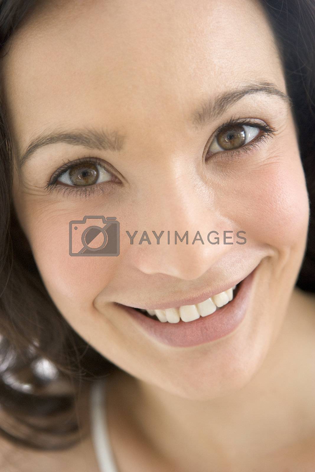 Royalty free image of Head shot of woman smiling by MonkeyBusiness