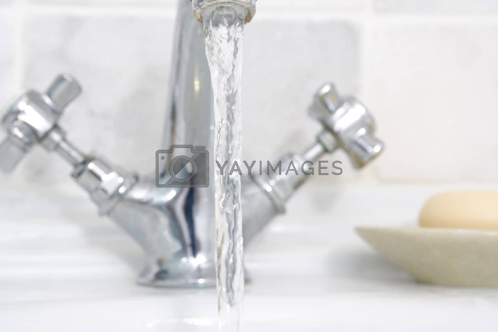 Royalty free image of Running bathroom sink by MonkeyBusiness