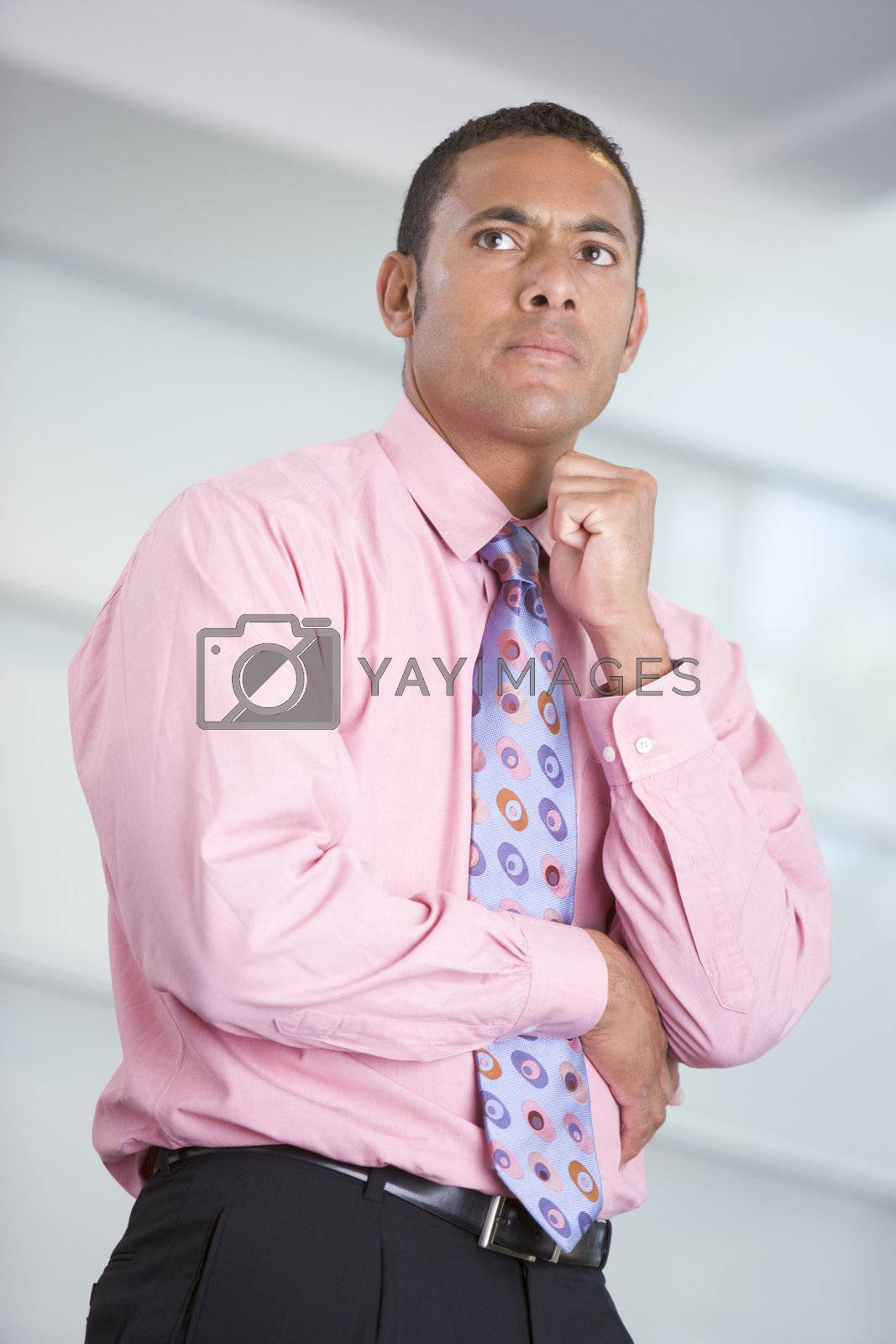 Royalty free image of Businessman standing indoors by MonkeyBusiness