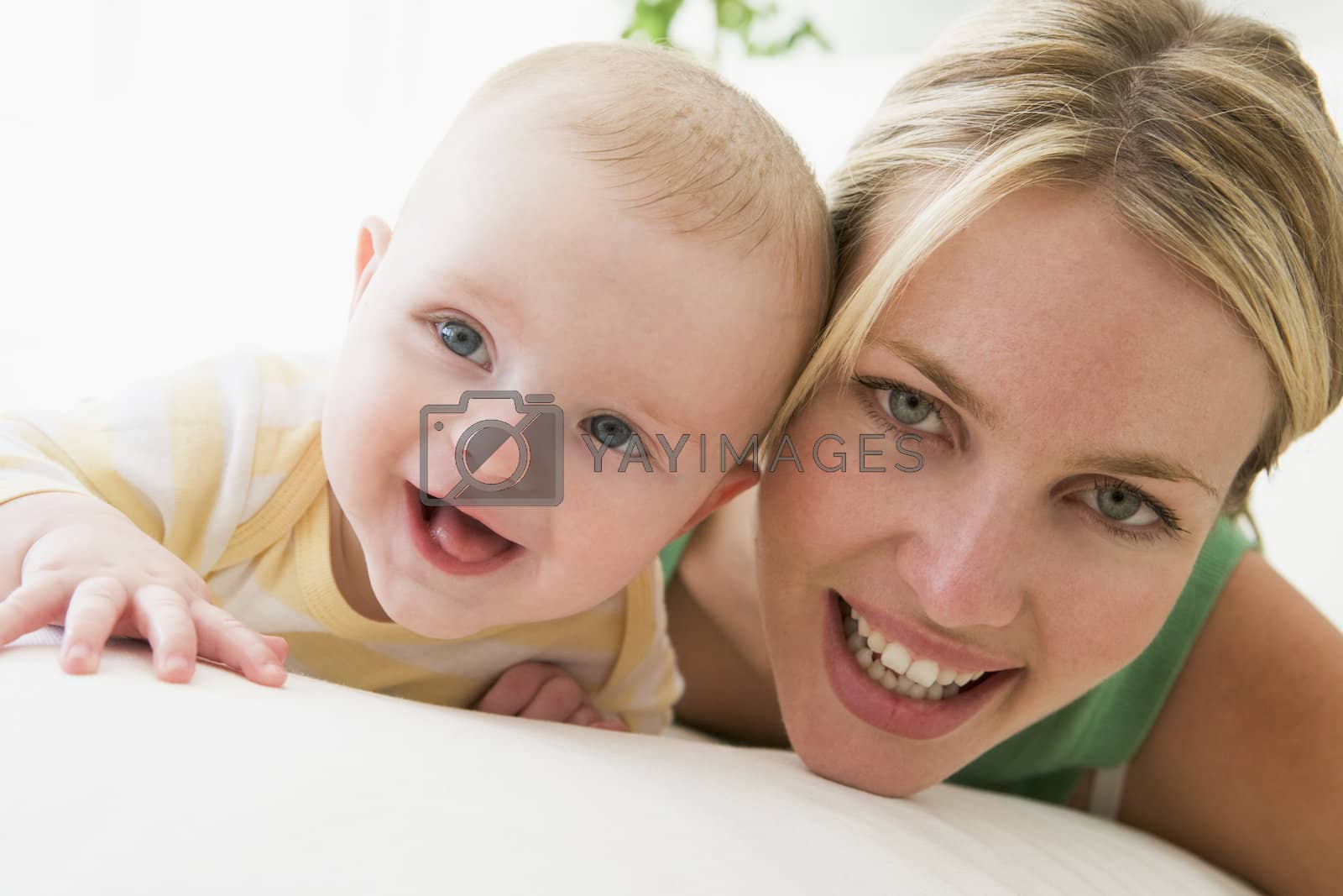 Royalty free image of Mother and baby indoors smiling by MonkeyBusiness