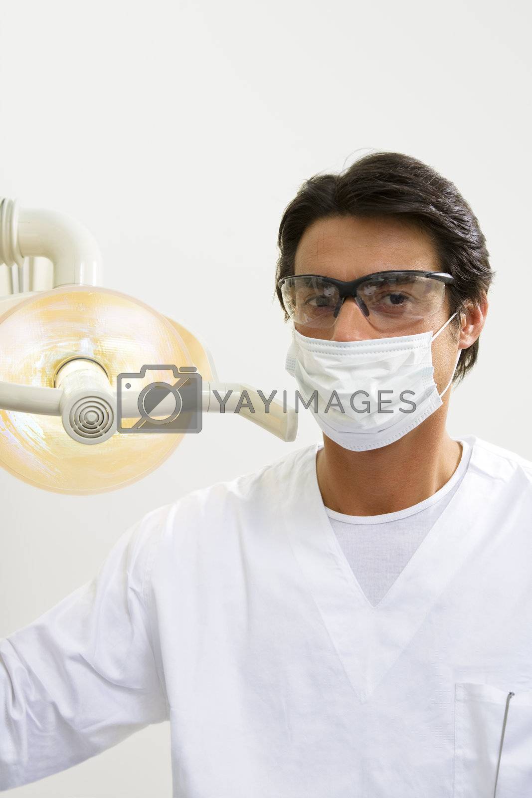 dentist turning on examination light