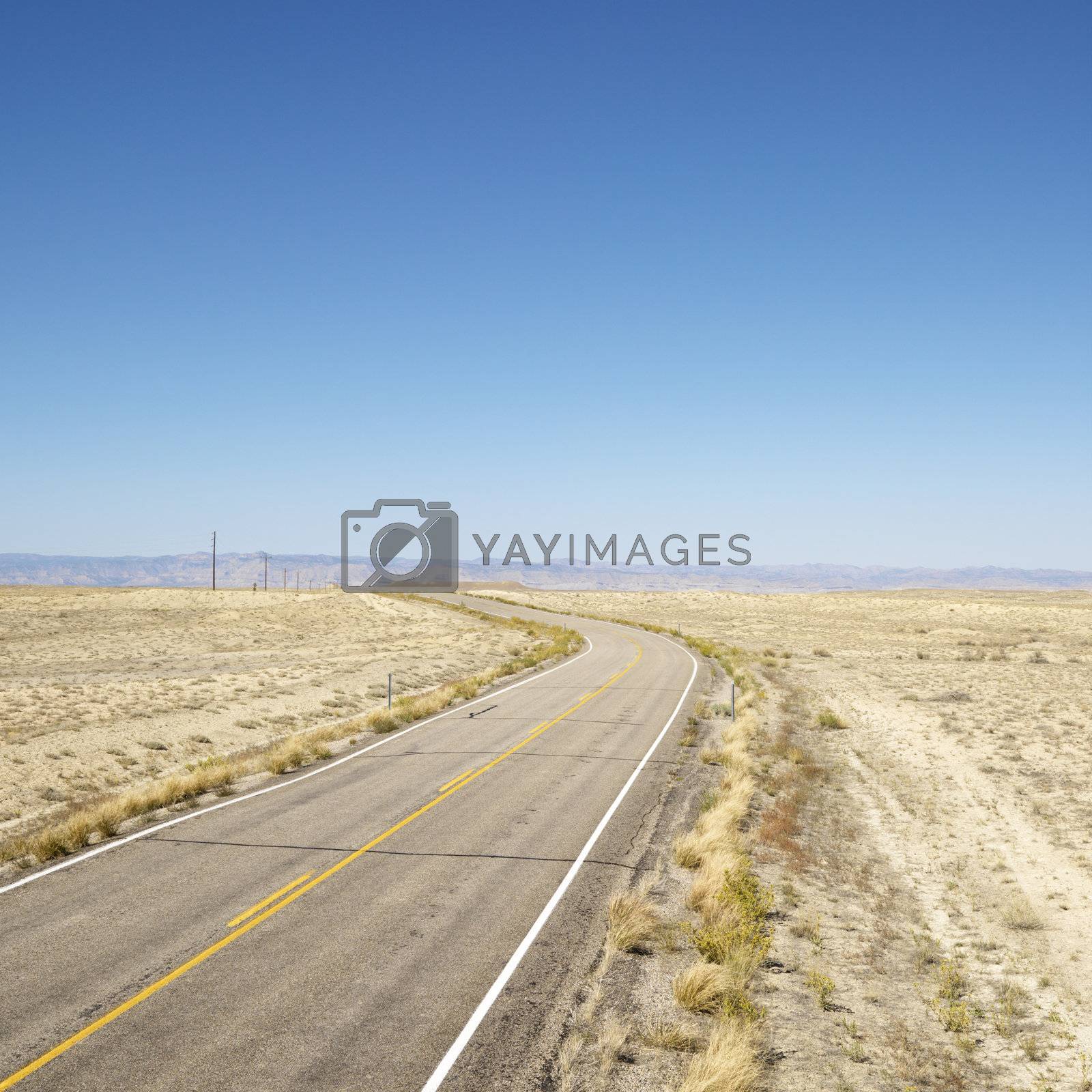 Royalty free image of Road through barren landscape. by iofoto
