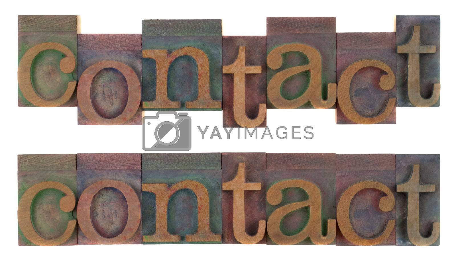 Royalty free image of contact - old wooden letterpress type by PixelsAway