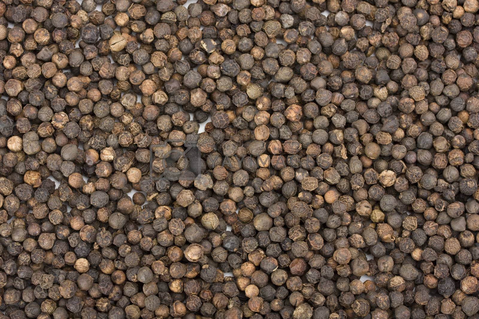 Royalty free image of a lot of peppercorns useful as background by bernjuer