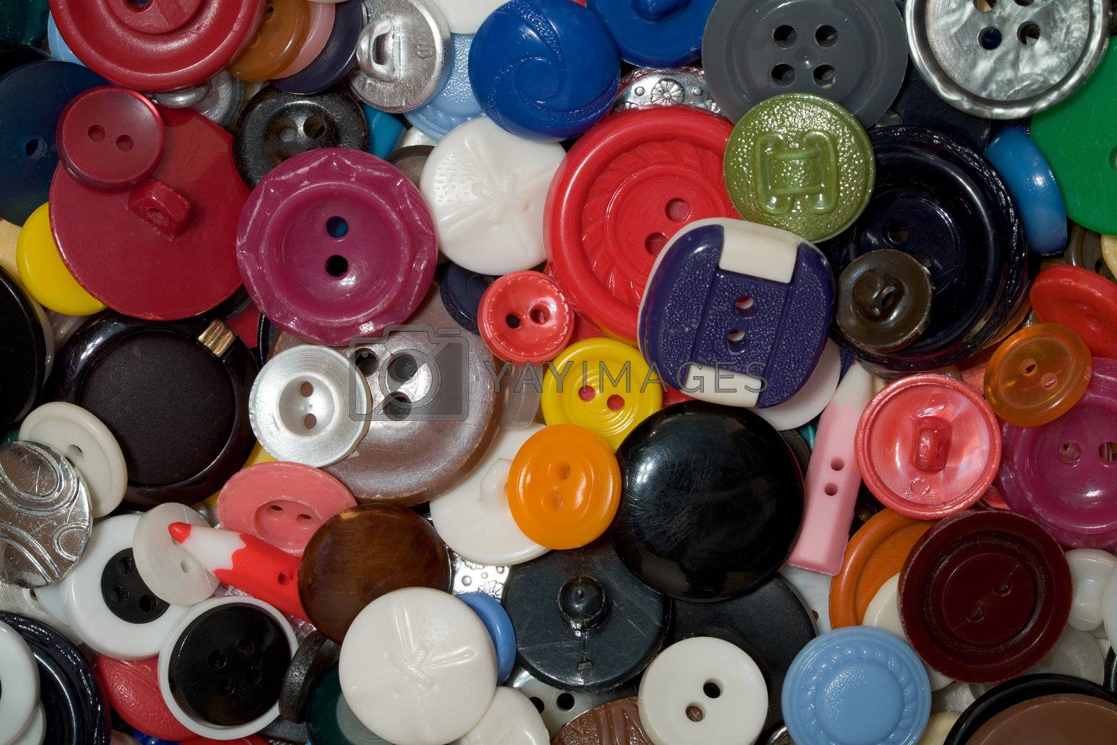 Royalty free image of  Multicolored plastic and metal button by pzaxe