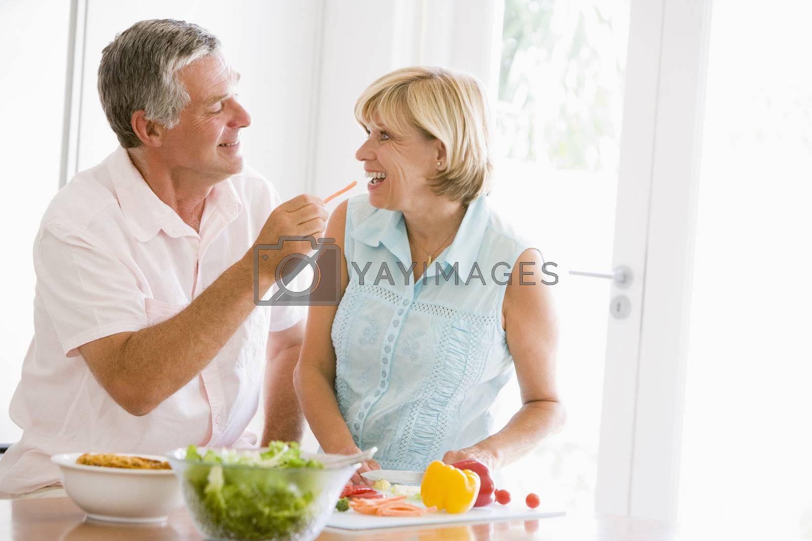 Royalty free image of Husband And Wife Preparing meal,mealtime Together by MonkeyBusiness