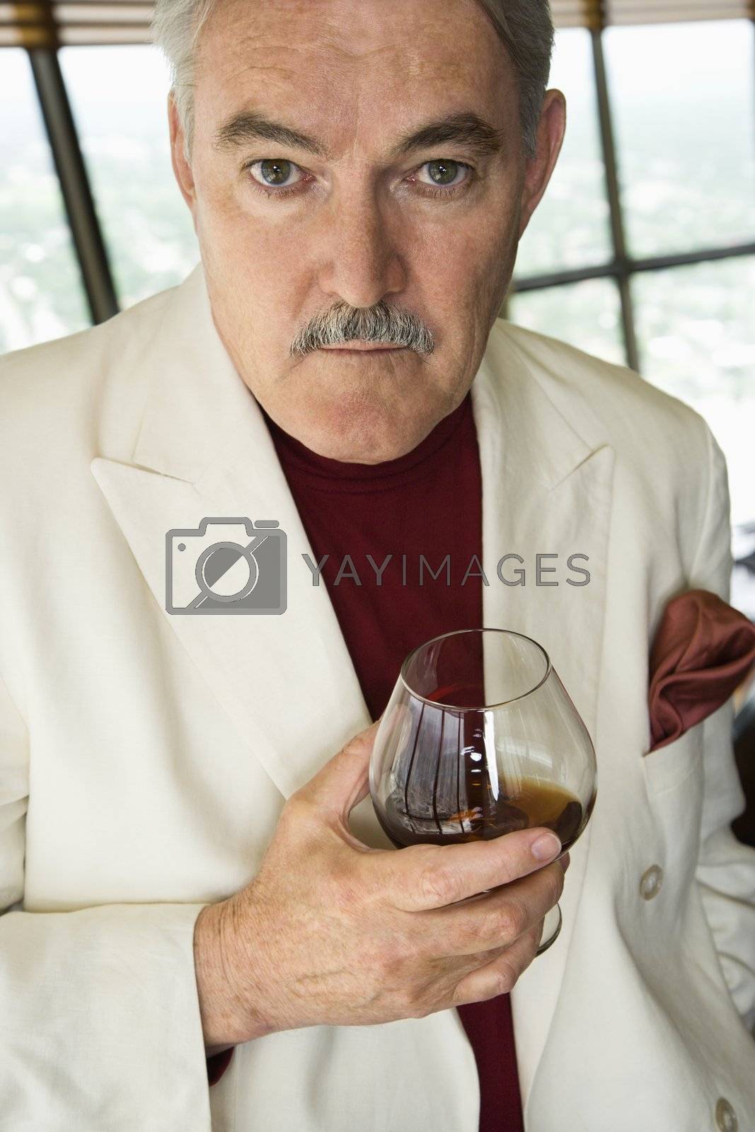 Royalty free image of Man holding drink. by iofoto