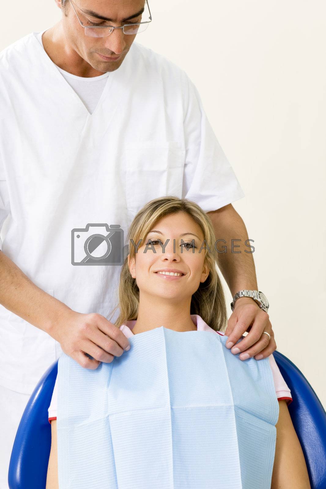 dentist and his patient in examination room