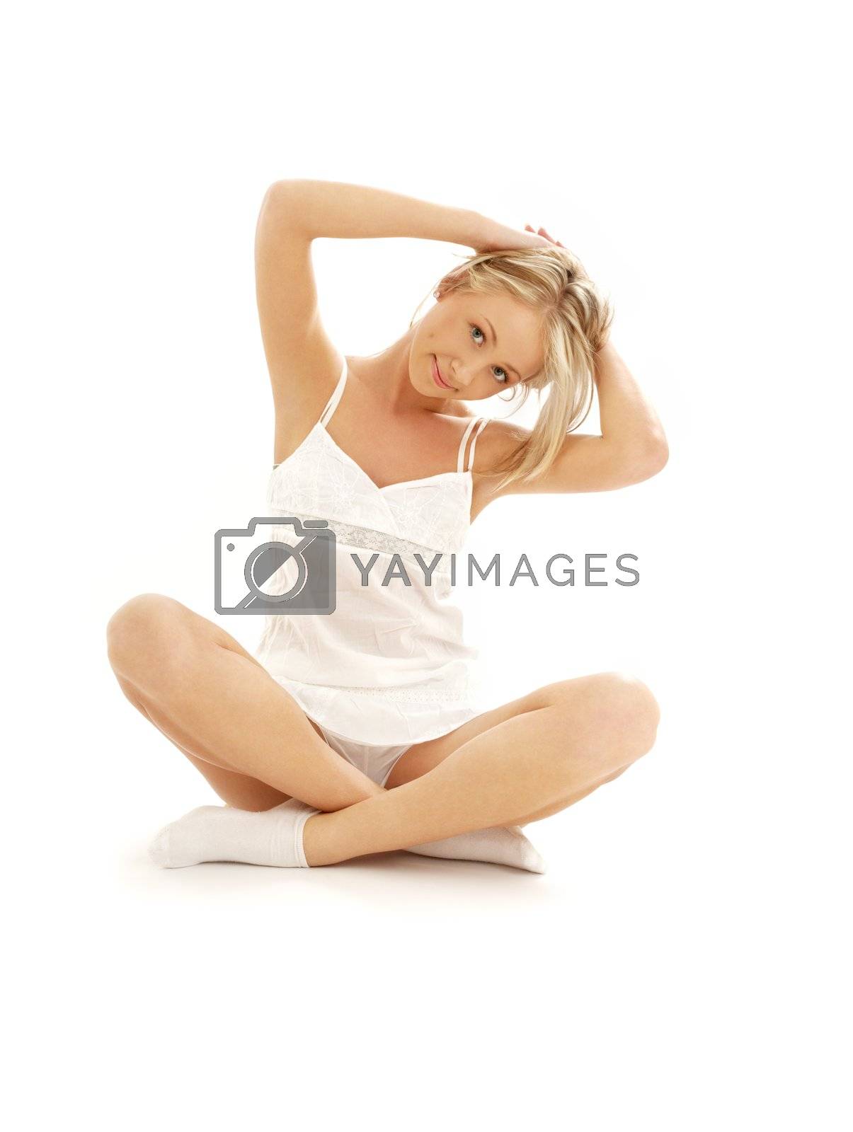 Royalty free image of lovely girl working out over white by dolgachov