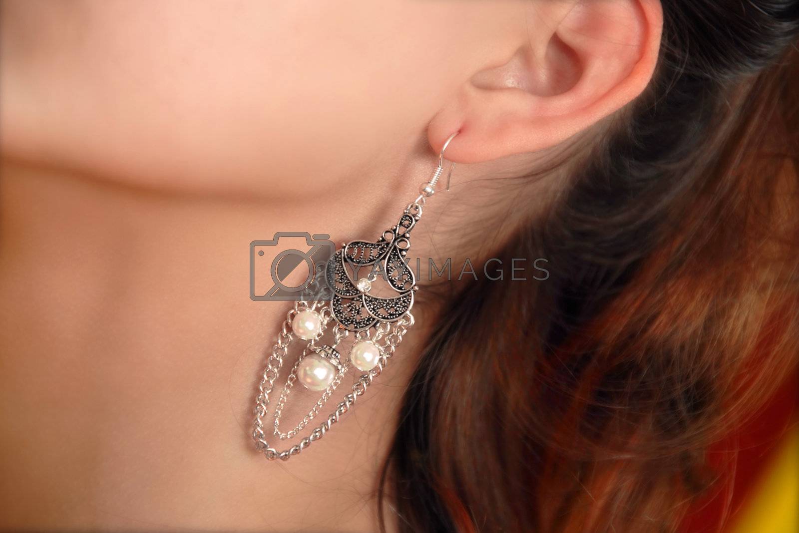 Royalty free image of earring by simply