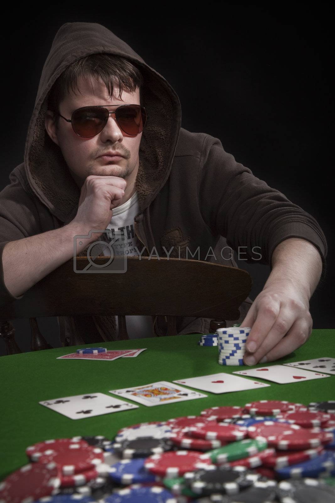 Royalty free image of Man playing poker by mjp