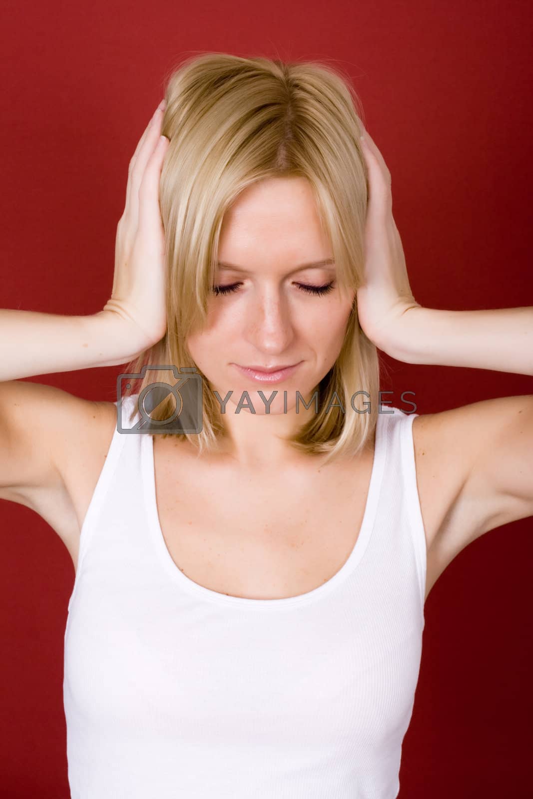 Royalty free image of woman covering her ears  by marylooo