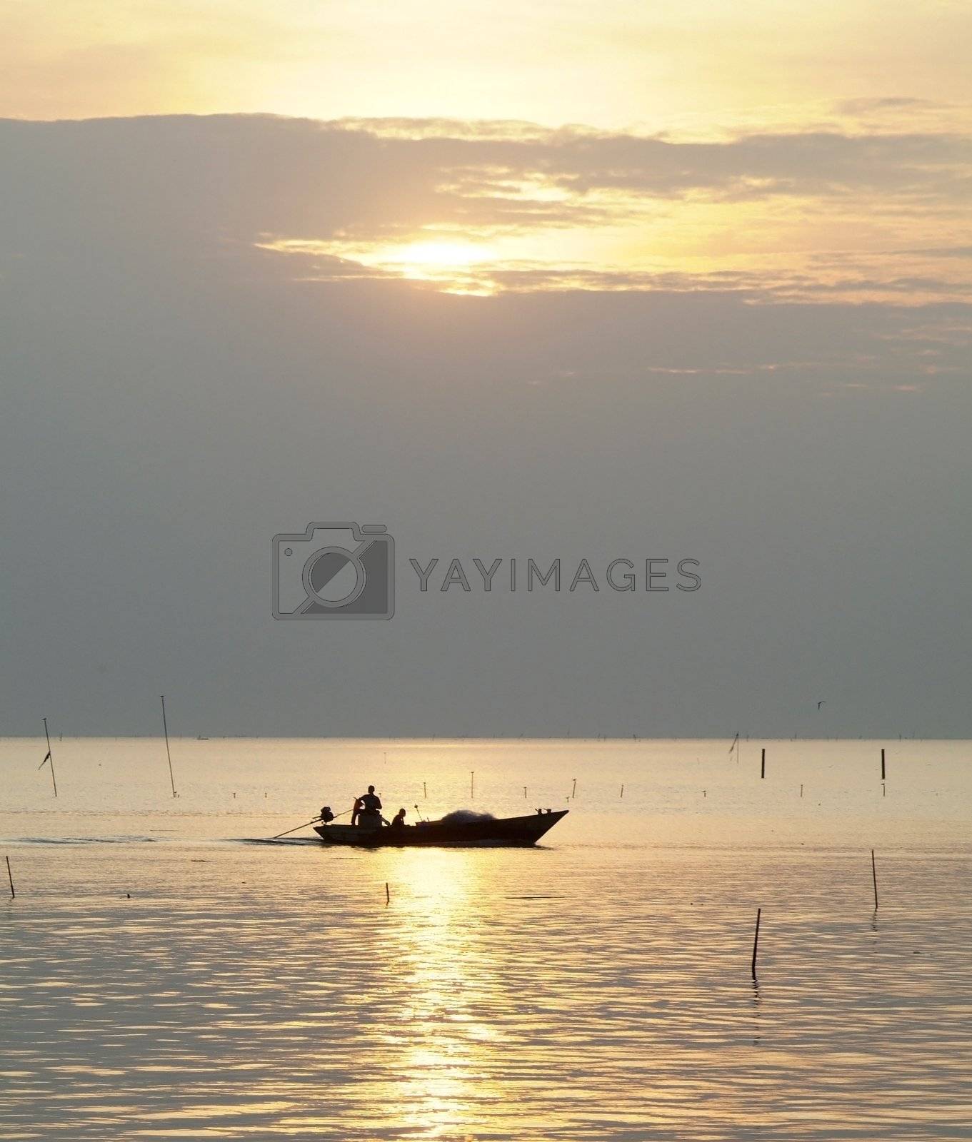 Royalty free image of Fishing boat at sunset by epixx