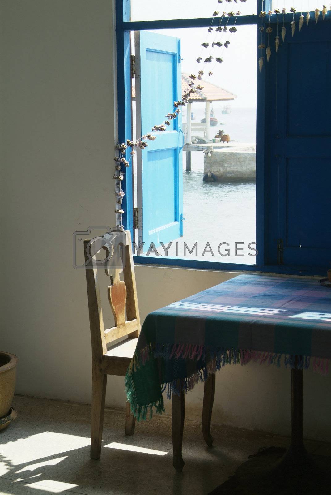 Royalty free image of Chair by the window by epixx