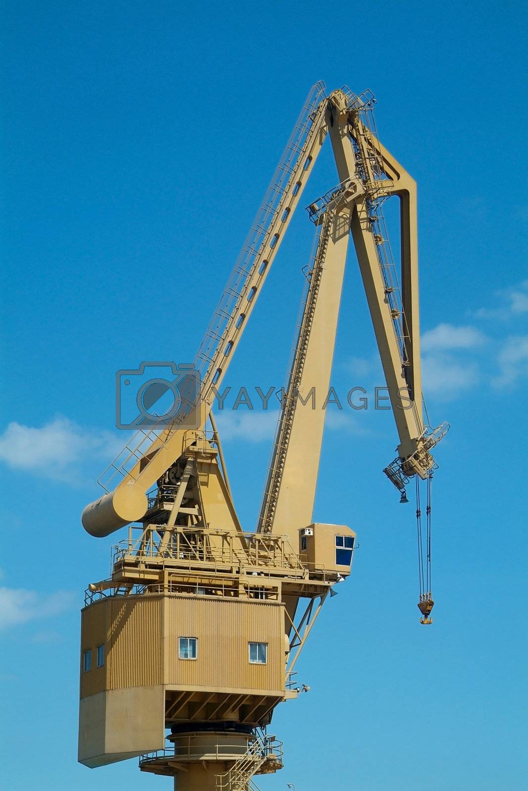 Royalty free image of Yellow harbour crane by epixx