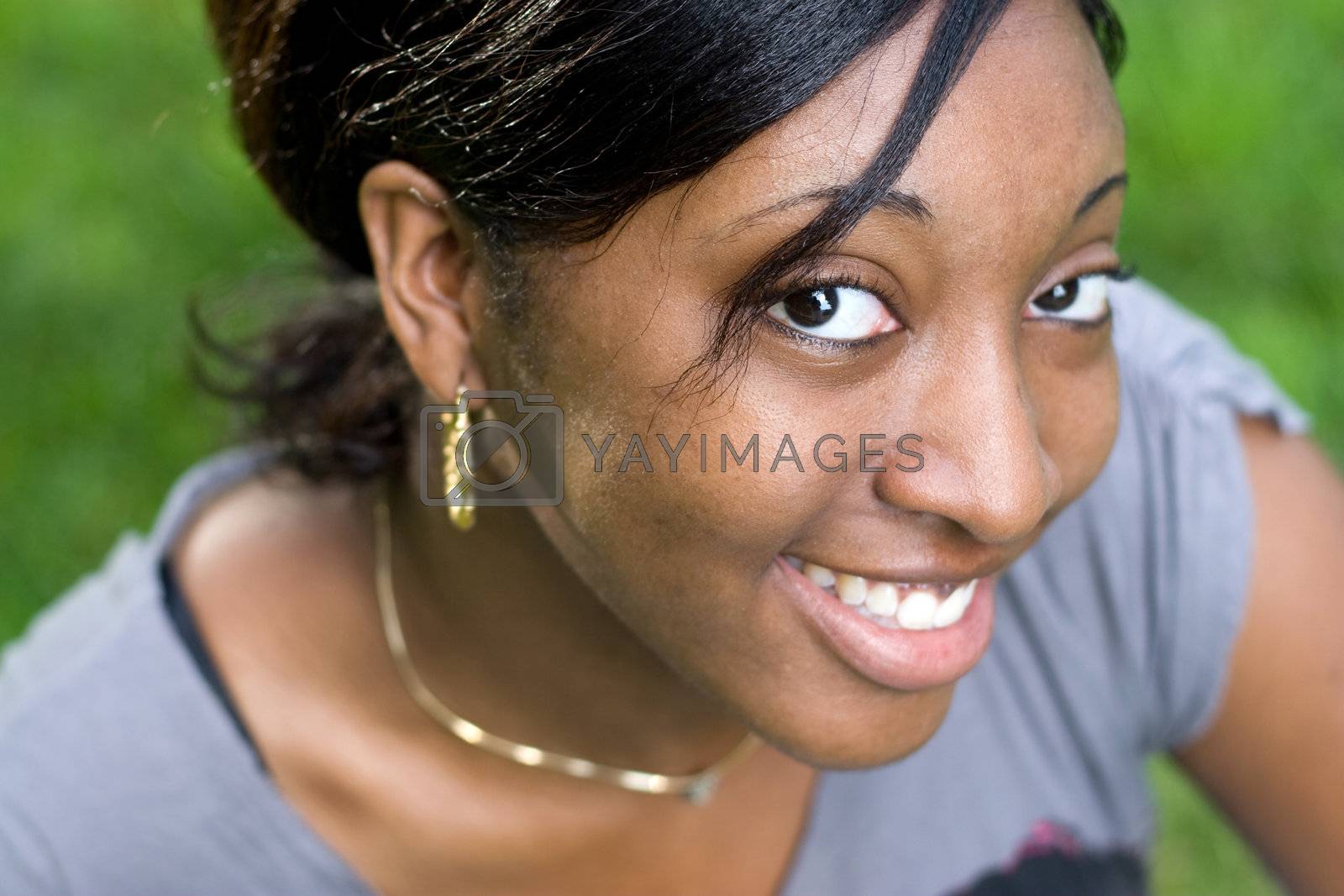 Royalty free image of Smiling Young Woman by graficallyminded