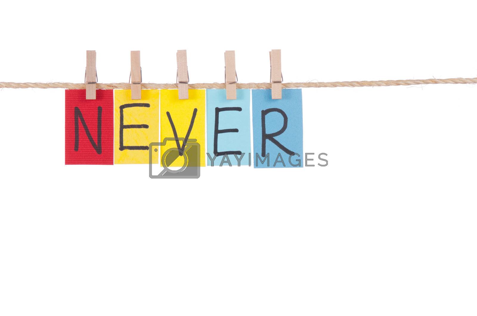Royalty free image of Never, Wooden peg  and colorful words by Lawren