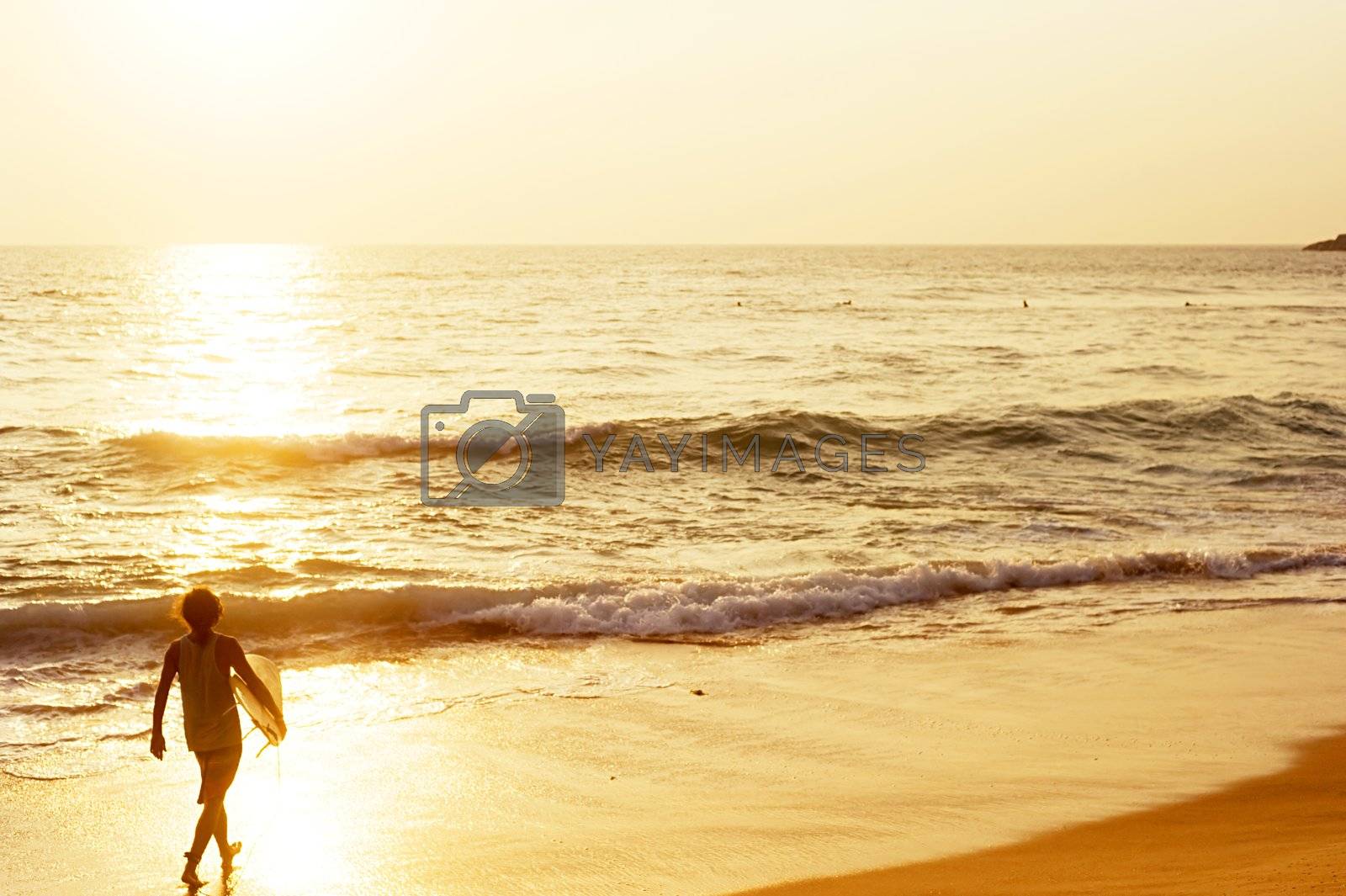 Royalty free image of Surfer on the beach by joyfull
