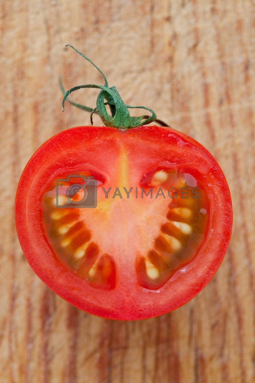 Royalty free image of Half a fresh tomato by raphotography