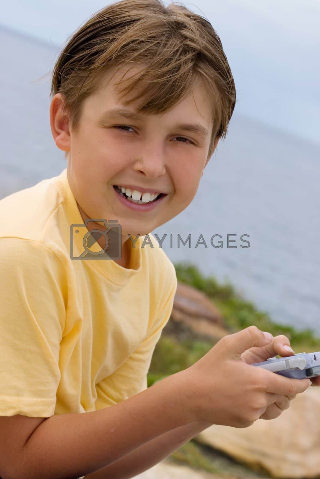 Royalty free image of Child with handheld game by lovleah