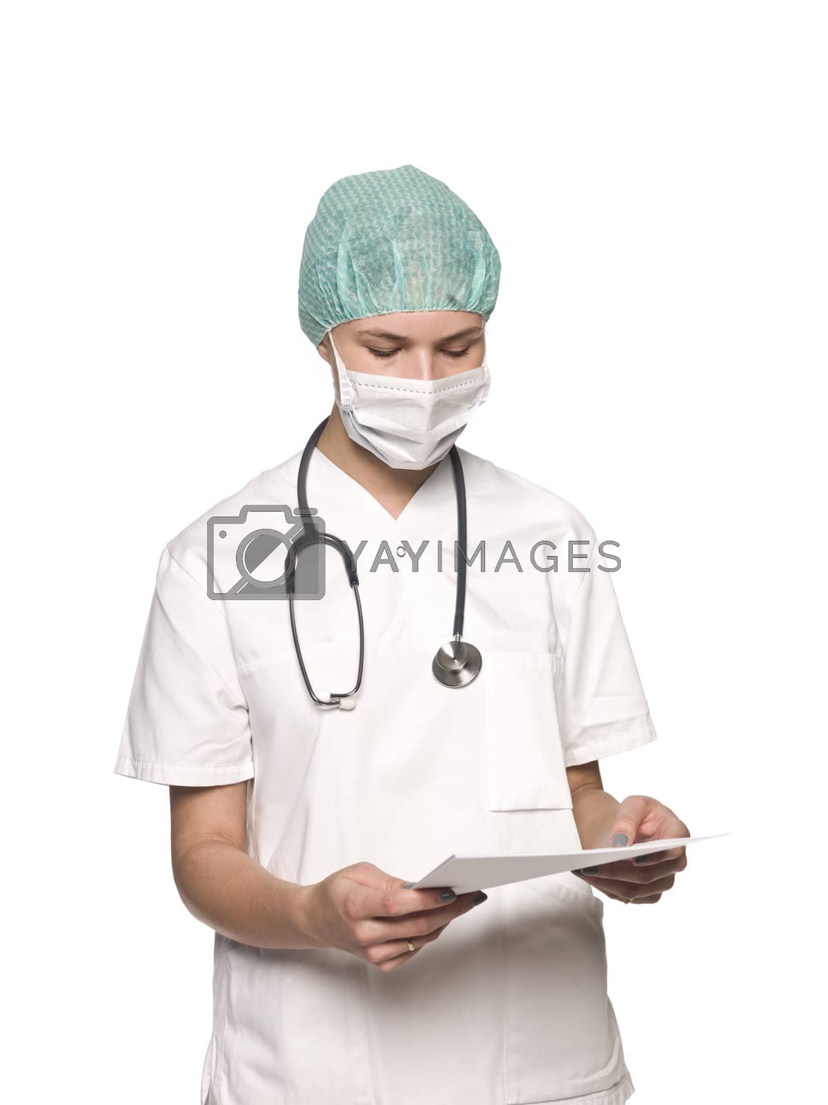 Royalty free image of Nurse with stethoscope and a journal towards white background by gemenacom