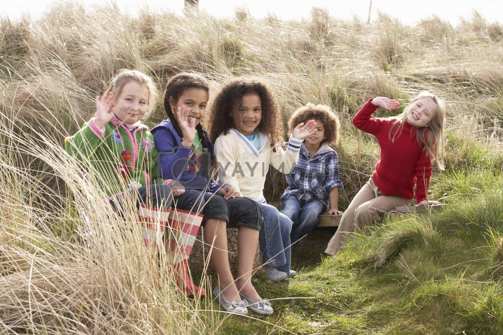 Royalty free image of Group Of Children Playing In Field Together by omg_images