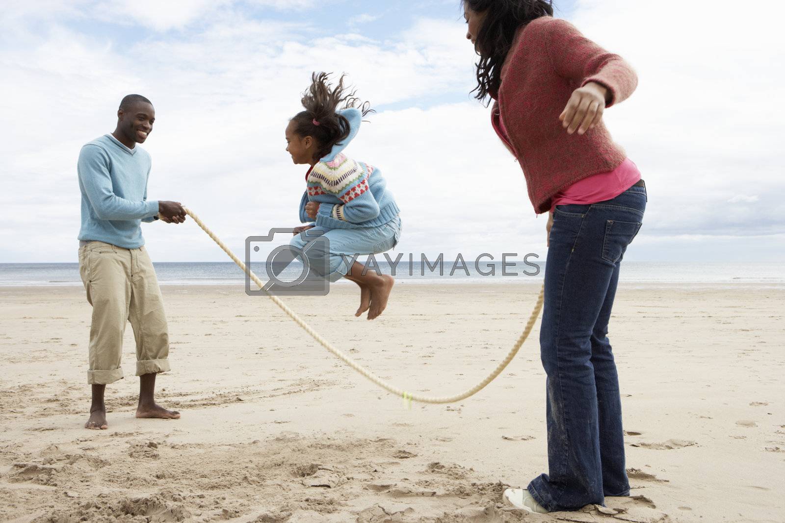 Royalty free image of Family playing on beach by omg_images