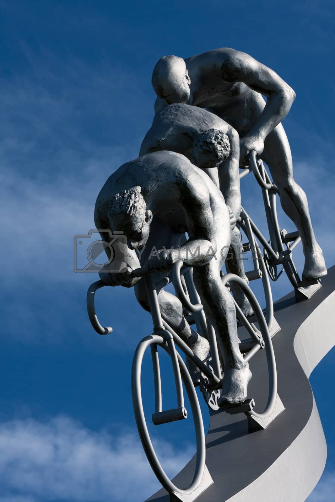 Royalty free image of Three cyclists in a slope by allg