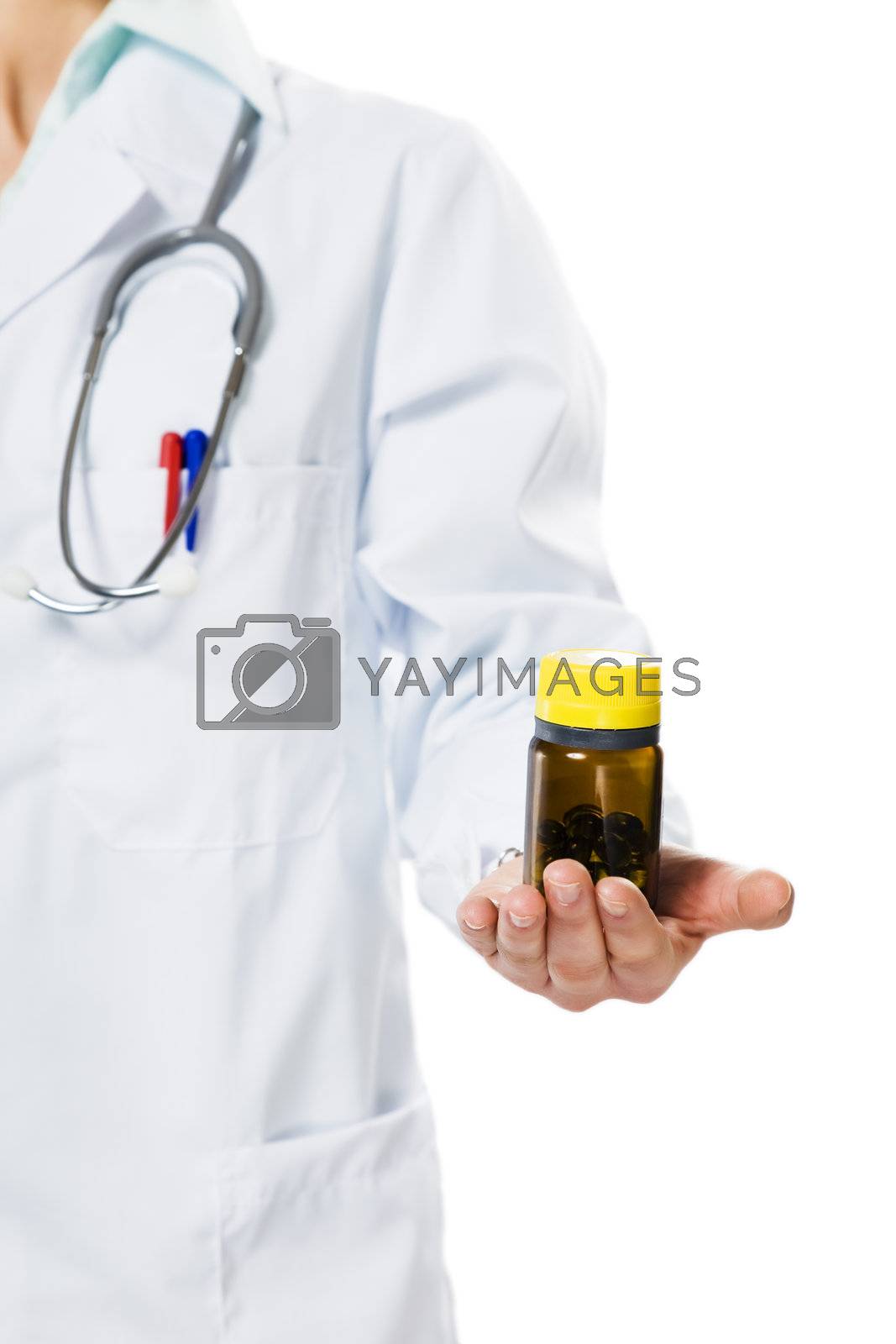 healthcare and medicine: doctor with bottle of pills in her hand