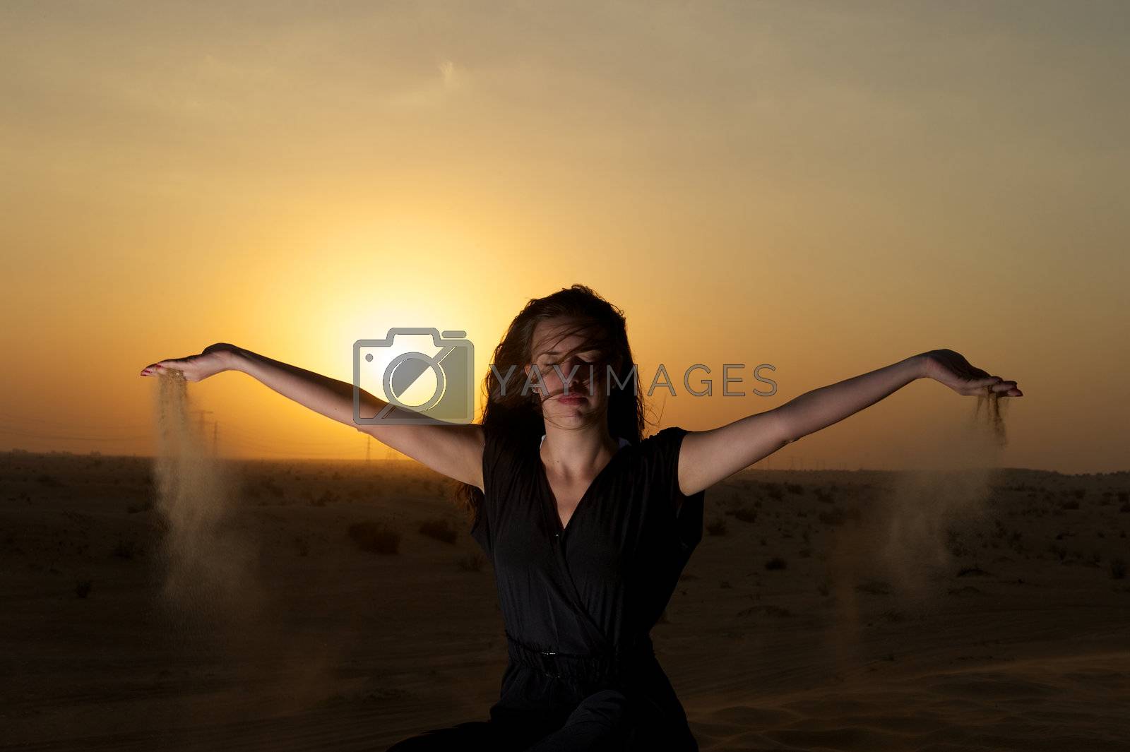 Royalty free image of Woman in the desert by swimnews