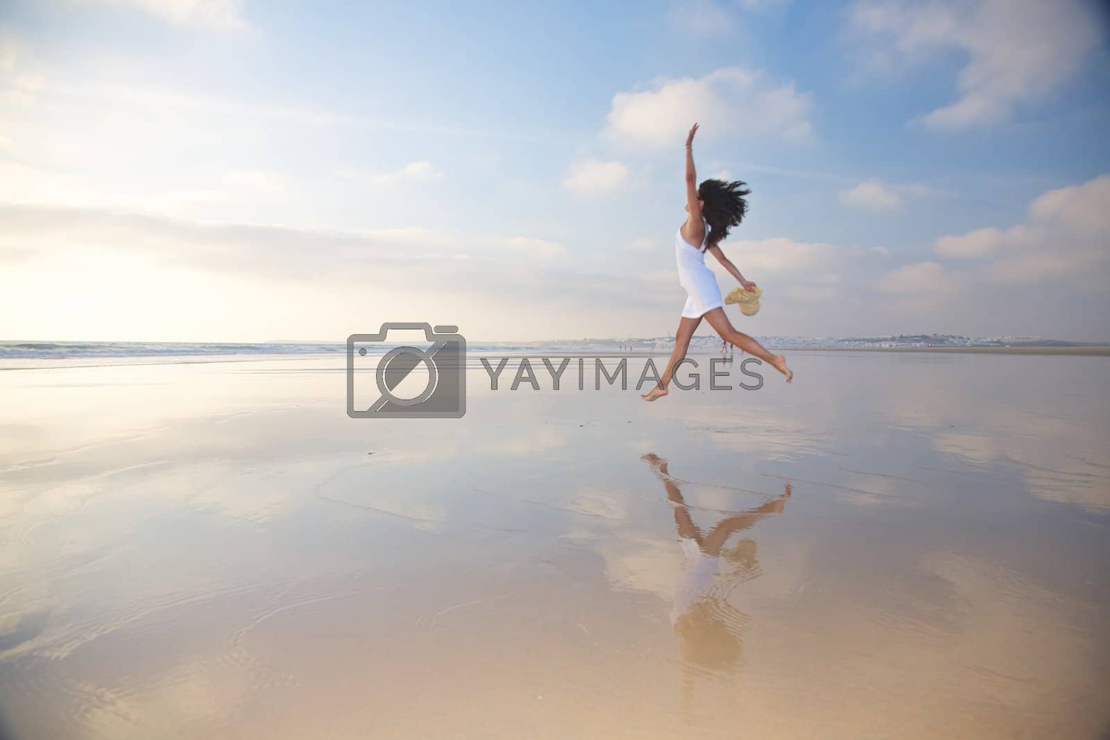 Royalty free image of jumping at seashore by quintanilla