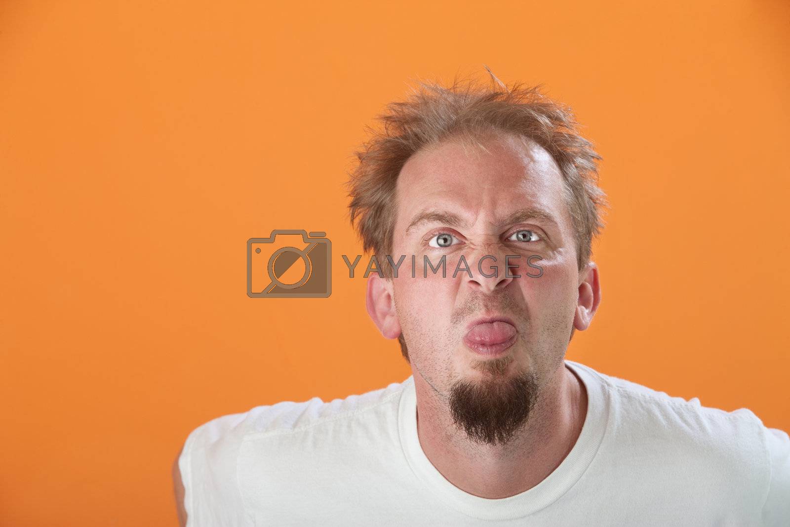 Royalty free image of Man Sticks Out His Tongue by Creatista