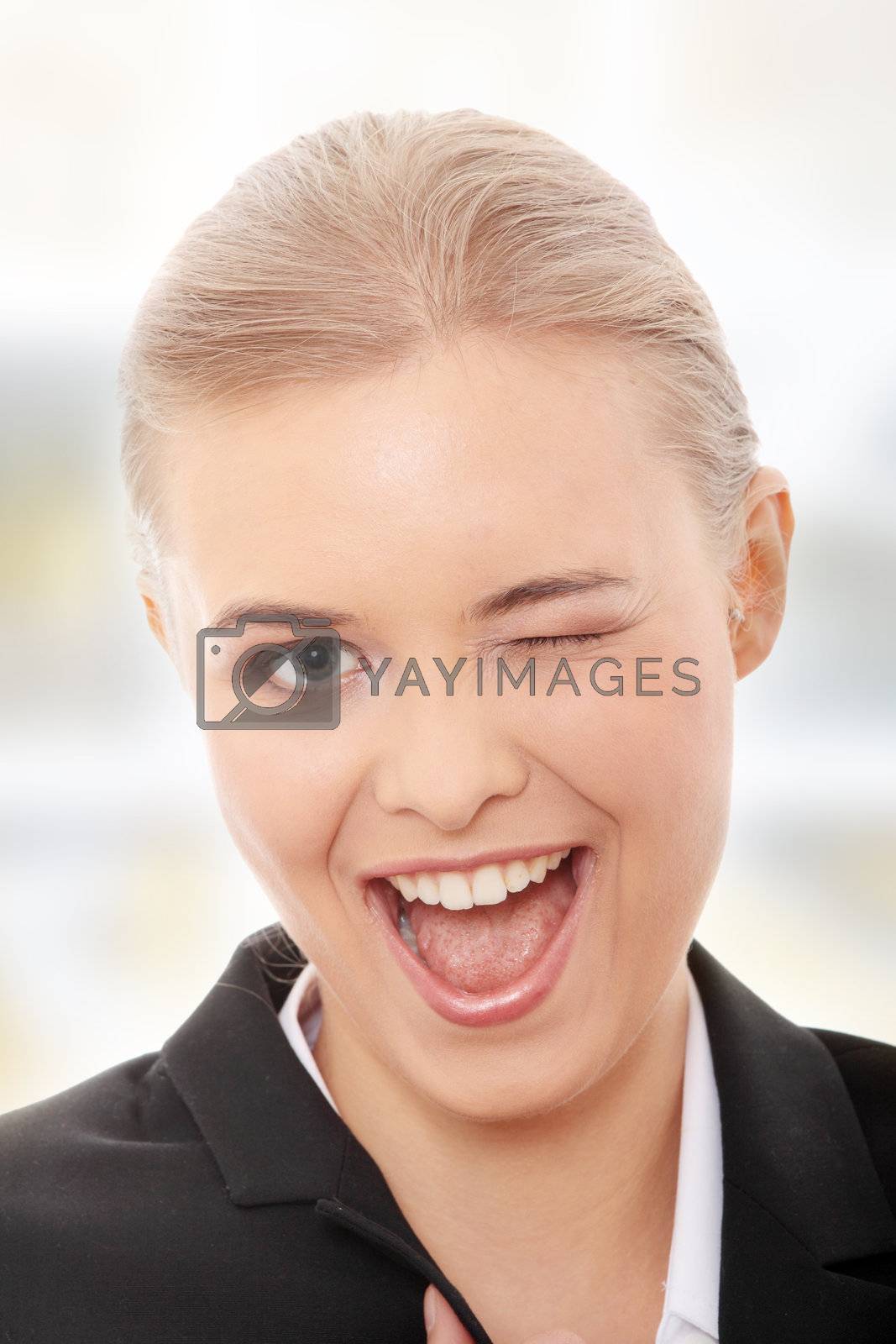 Royalty free image of Businesswoman with big smile blinking by BDS