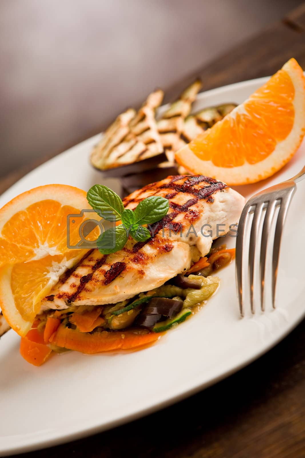 Royalty free image of Grilled chicken breast on ratatouille bed by genious2000de