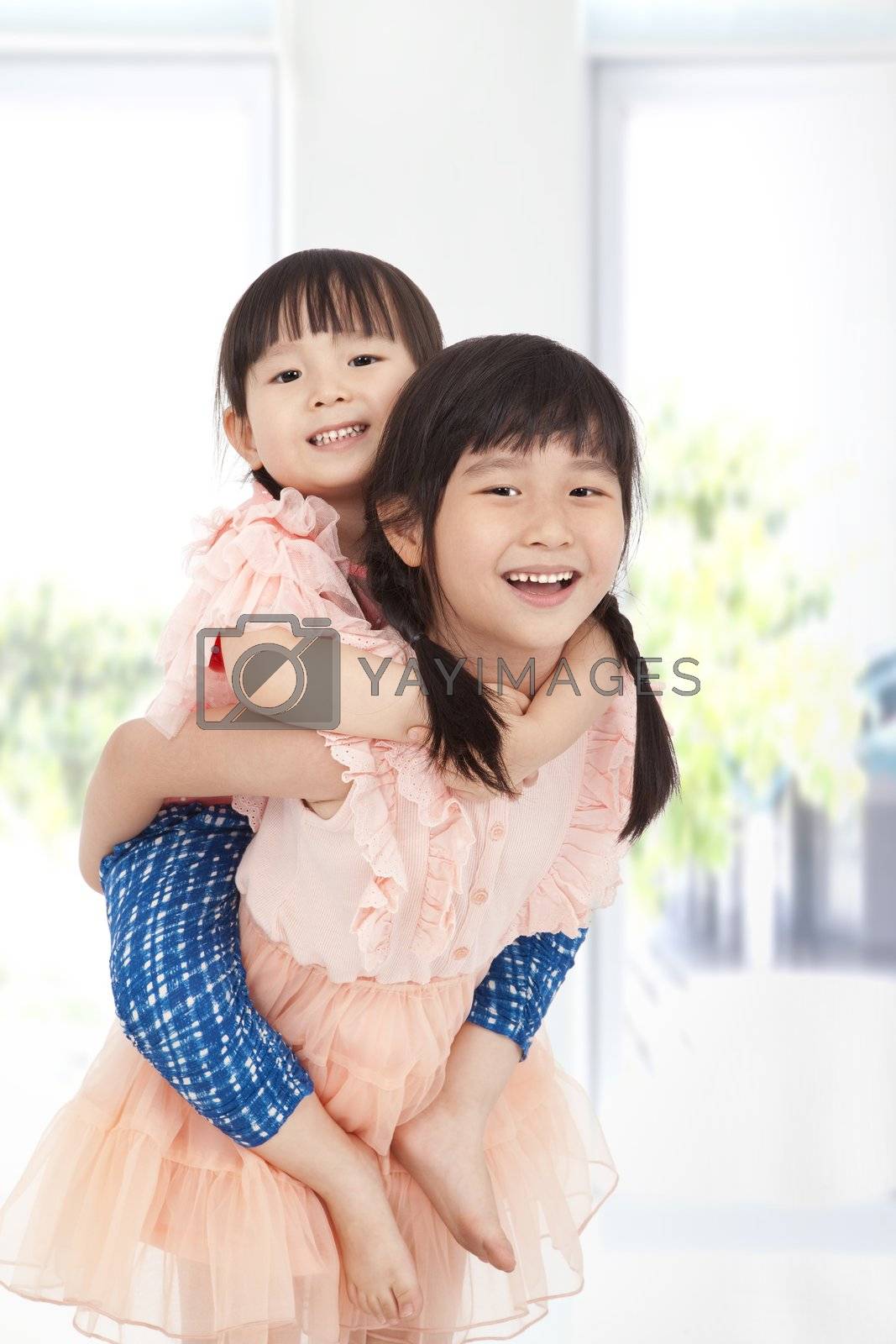 Royalty free image of happy asian girls by tomwang