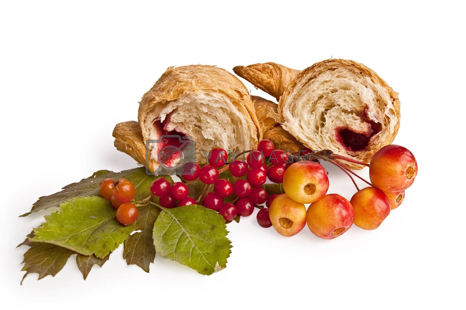 Royalty free image of Croissant with berries and apples by rezkrr
