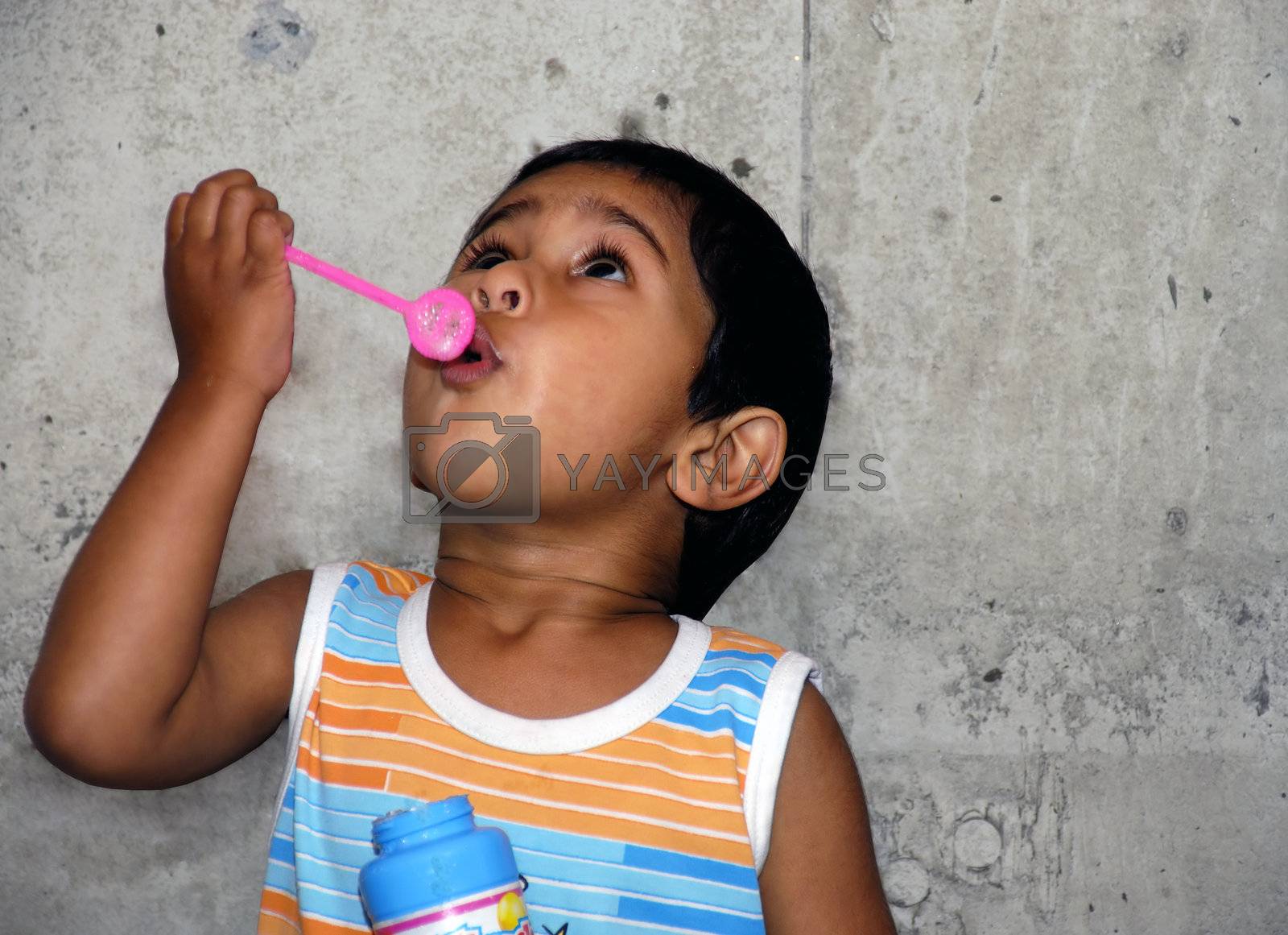 Royalty free image of Blowing bubbles by pazham