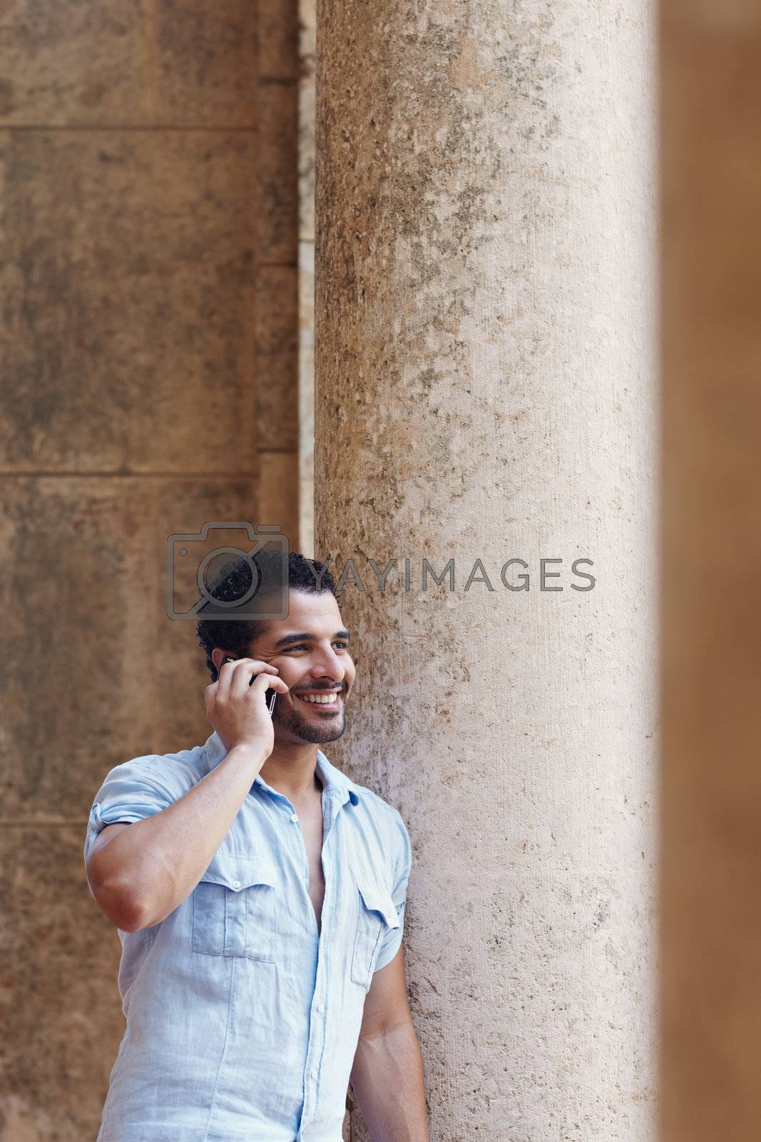 Royalty free image of man talking on cellphone by diego_cervo