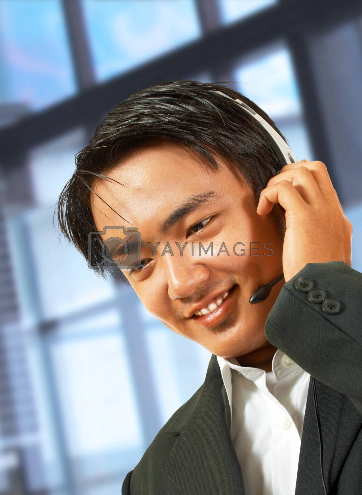 Customer Service Helpdesk Operator Talking To A Customer And Wearing A Headset